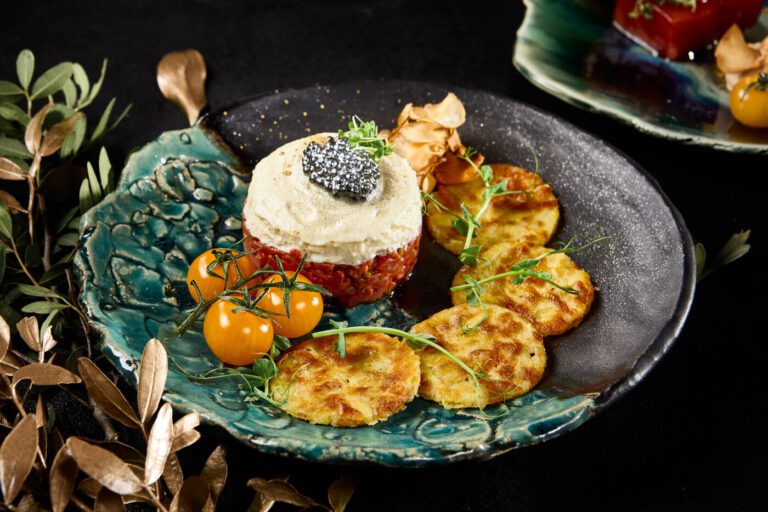 Gourmet Beef Tartare with Draniki and Caviar on Artistic Plate